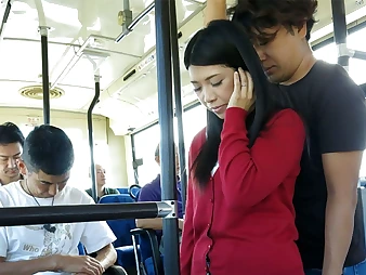 Black-haired Aimi Nagano gets her taut fuck hole spread in a bus ride
